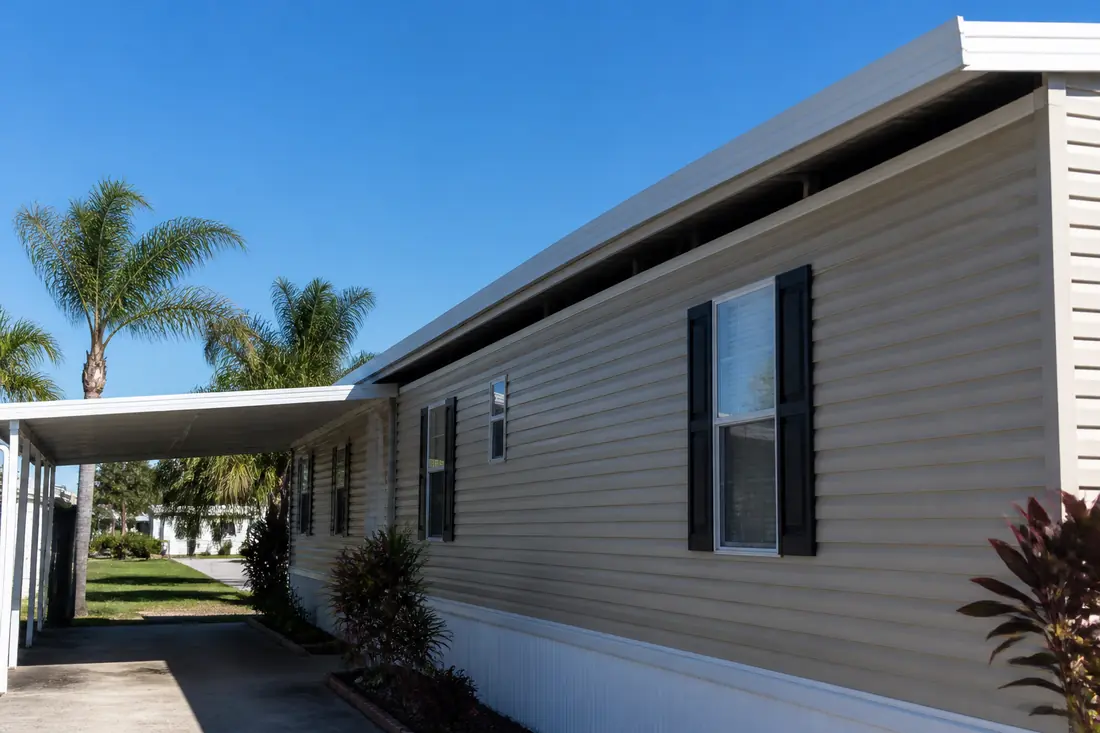 A metal roof-over installed above the original roof of a manufactured home