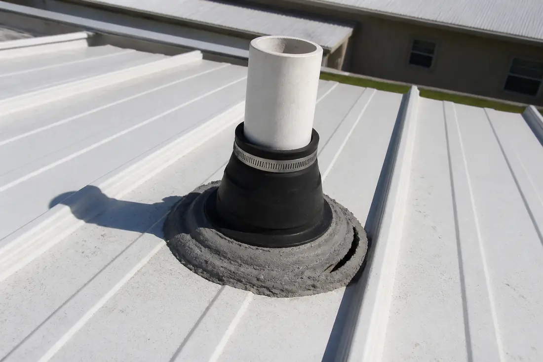 A roof vent penetration on a manufactured home with sealant around its base